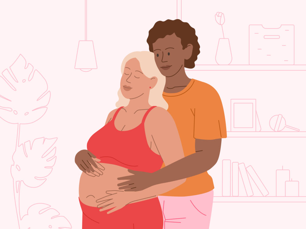 pregnant woman hugging her partner