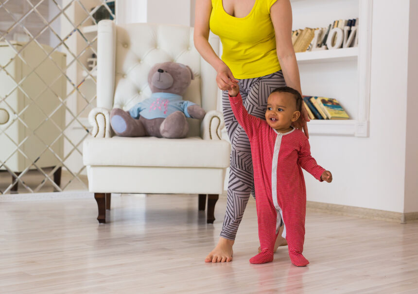 how to help baby stand on their own
